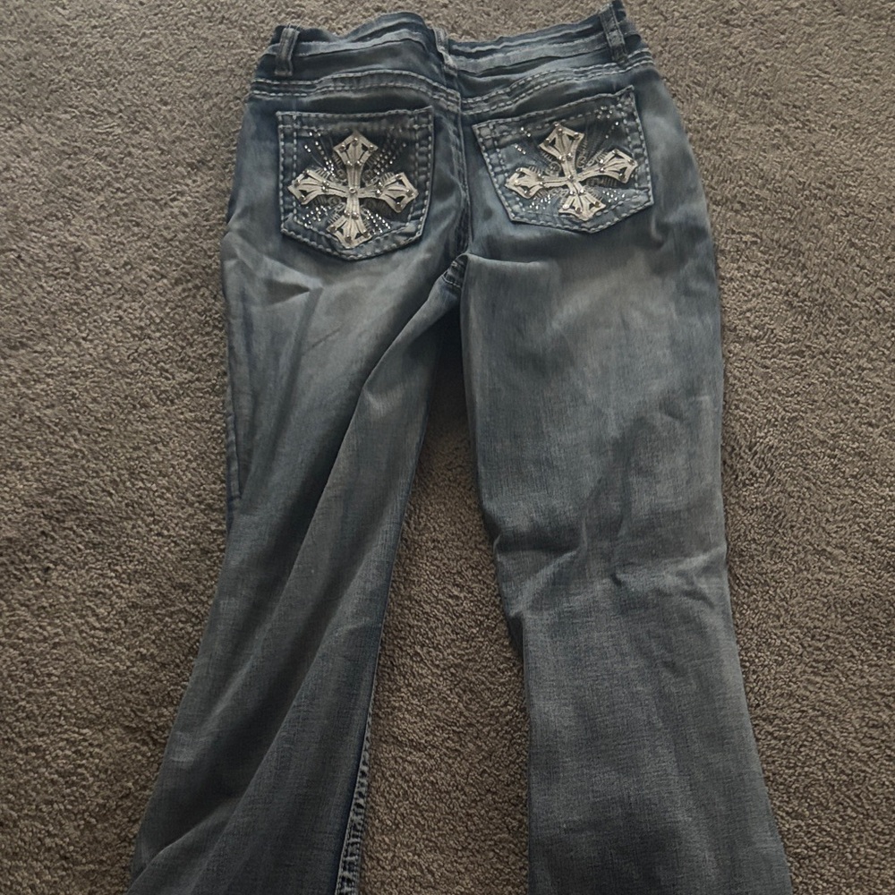 Elegant Gray Flare Jeans with Cross Details